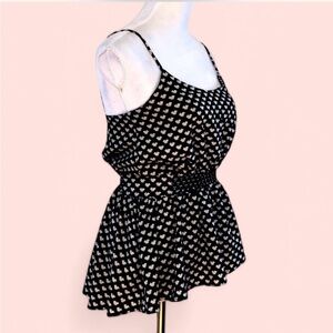 Peplum top with bow tie print